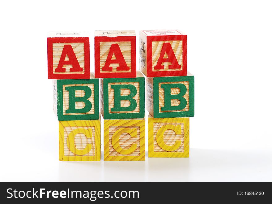 Children learning letter blocks isolated on white. Children learning letter blocks isolated on white