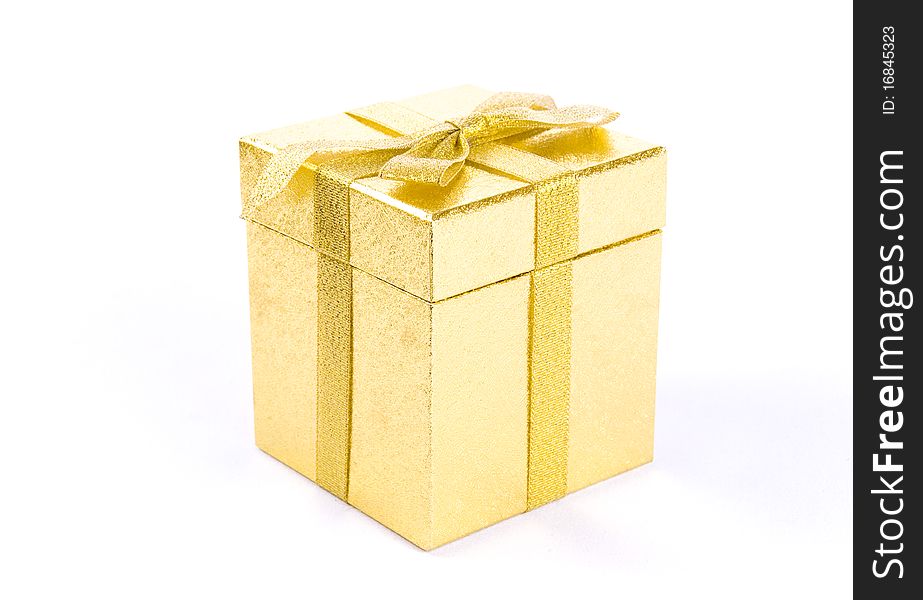 Christmas golden  giftbox on white background, with golden ribbon. Christmas golden  giftbox on white background, with golden ribbon