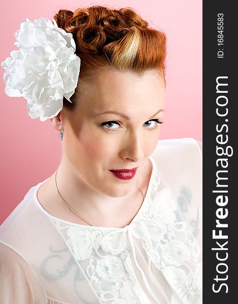 pinup model with flower in hair. pinup model with flower in hair