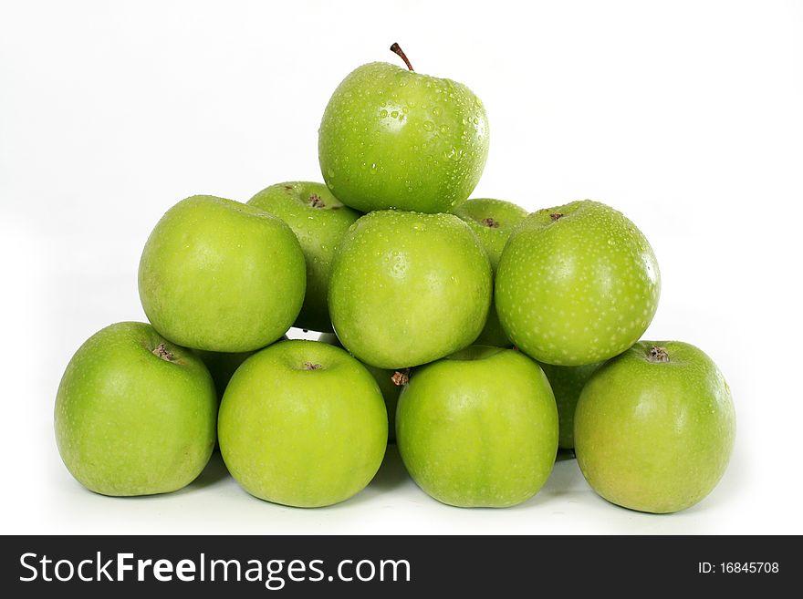 Several green apples on white background