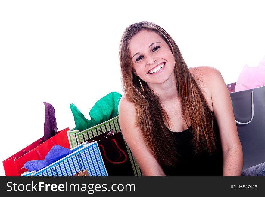 A happy girl with shopping bags, isolated on a white background. A happy girl with shopping bags, isolated on a white background.