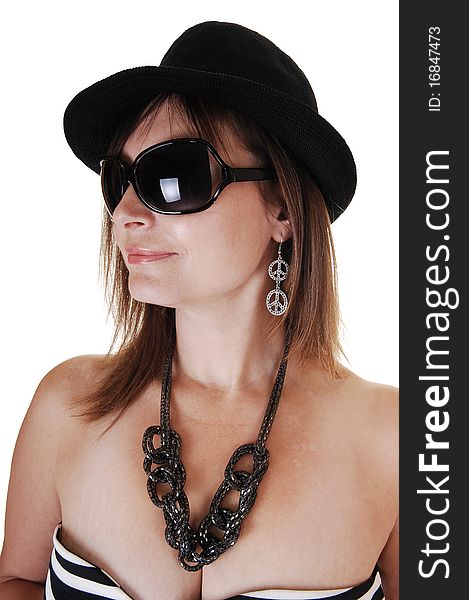 A closeup portrait of a middle aged woman with a black hat and 
big sunglasses a nice necklace and earrings, in profile. A closeup portrait of a middle aged woman with a black hat and 
big sunglasses a nice necklace and earrings, in profile.