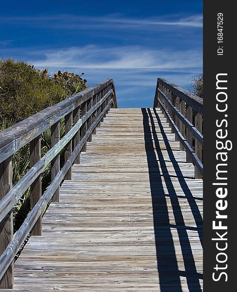 Walk bridge leading to the ocean over the hill. Walk bridge leading to the ocean over the hill.