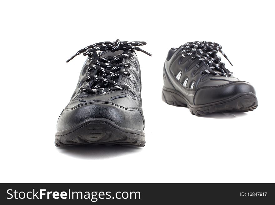 Black leather shoes on a white background