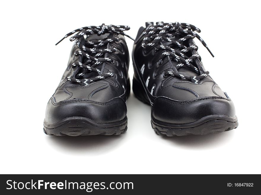 Black leather shoes on a white background