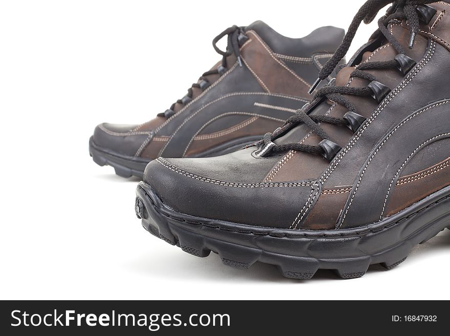 Series. Black leather shoes on a white background