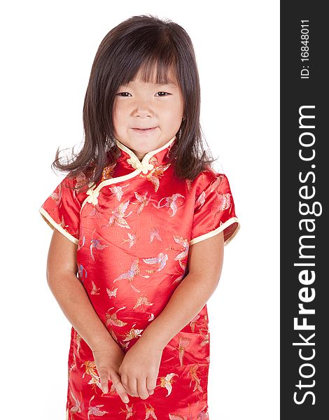 A young chinese girl is standing with a smile. A young chinese girl is standing with a smile.