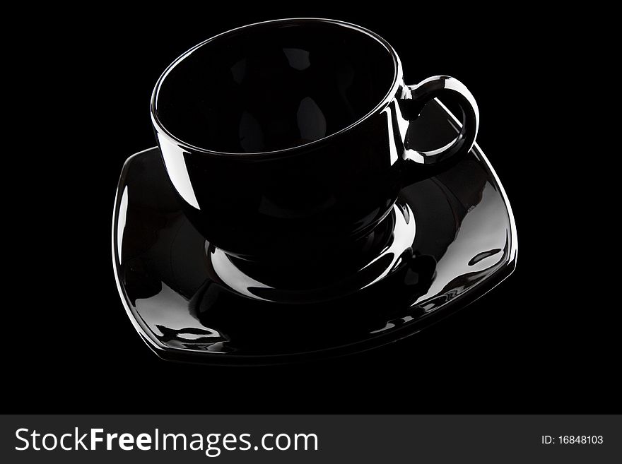 Black empty cup isolated on a white background. Black empty cup isolated on a white background