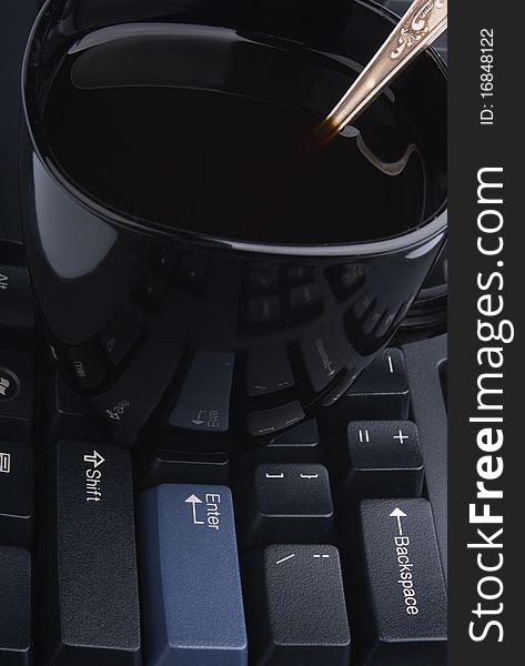 Cup On Computer Keyboard