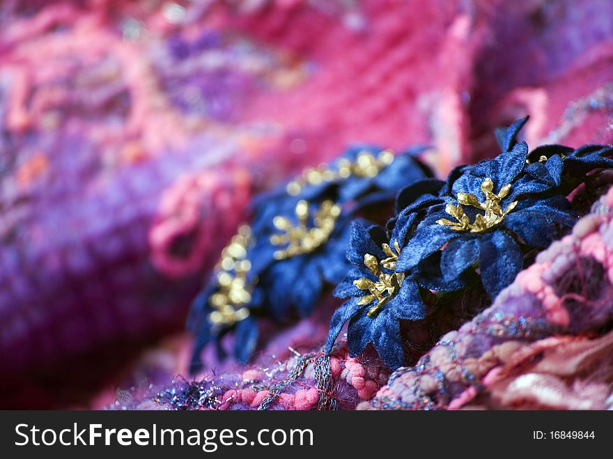 Decorative Christmas flowers on the soft colorful material. Decorative Christmas flowers on the soft colorful material