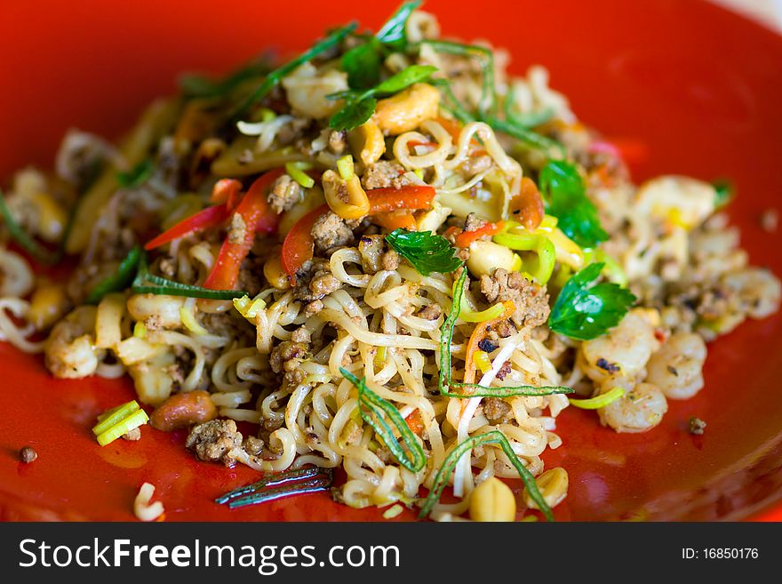 Spicy fried chinese flat rice noodles with seafood and vegetable. Spicy fried chinese flat rice noodles with seafood and vegetable