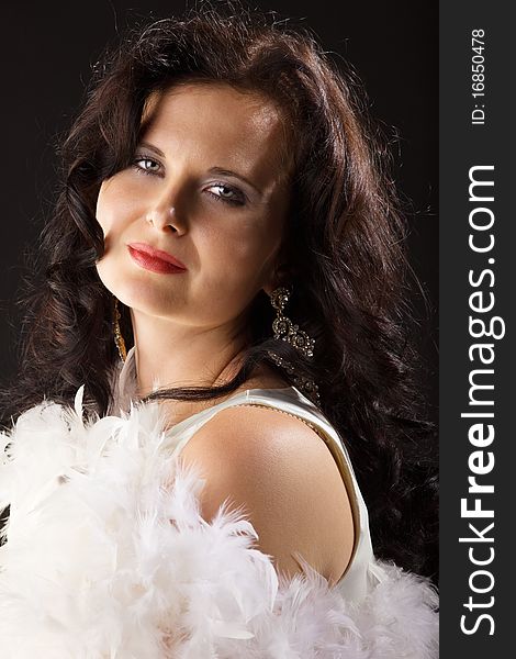 Glamour young woman in white feather boa. Glamour young woman in white feather boa