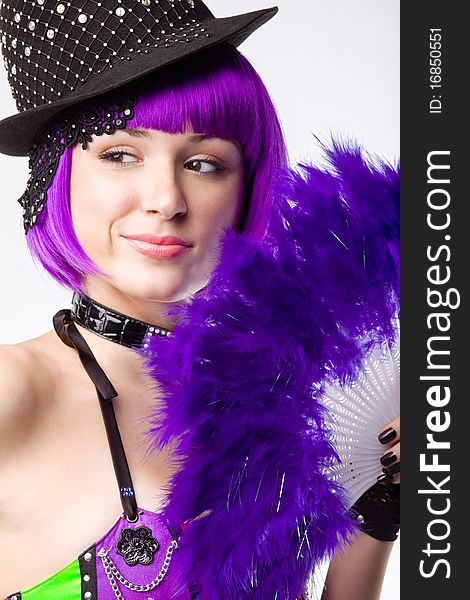 Young disco girl with purple fan