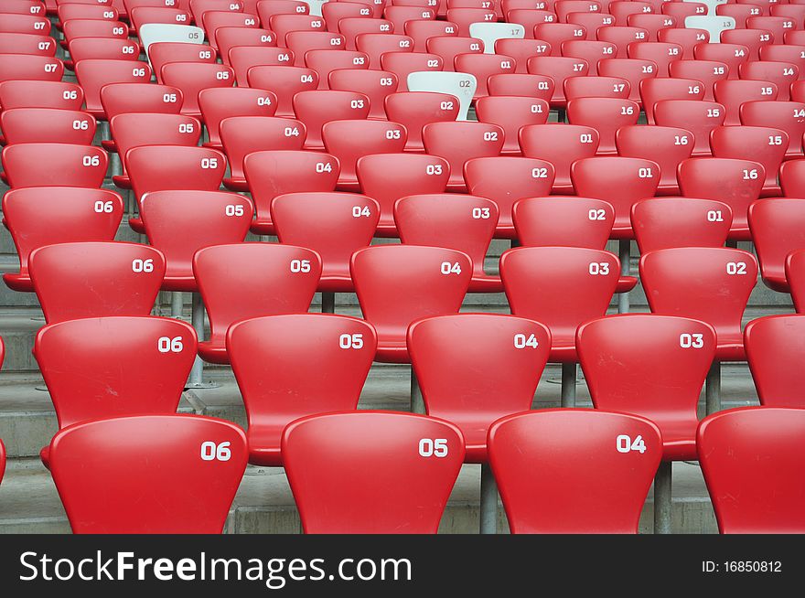 Red seats in the grandstand. Red seats in the grandstand