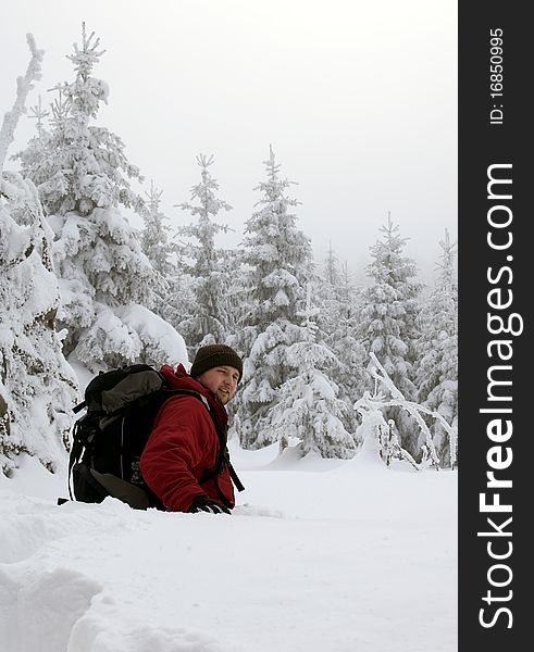 Young men hiking in winter landscape,no fake