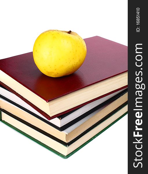 Books and apple isolated on white background