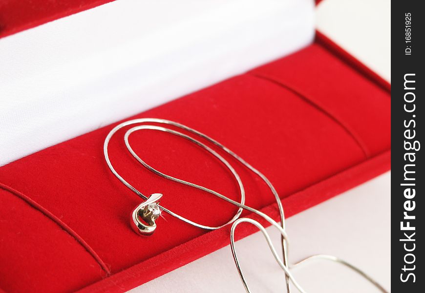 Gold necklace in red jewel box