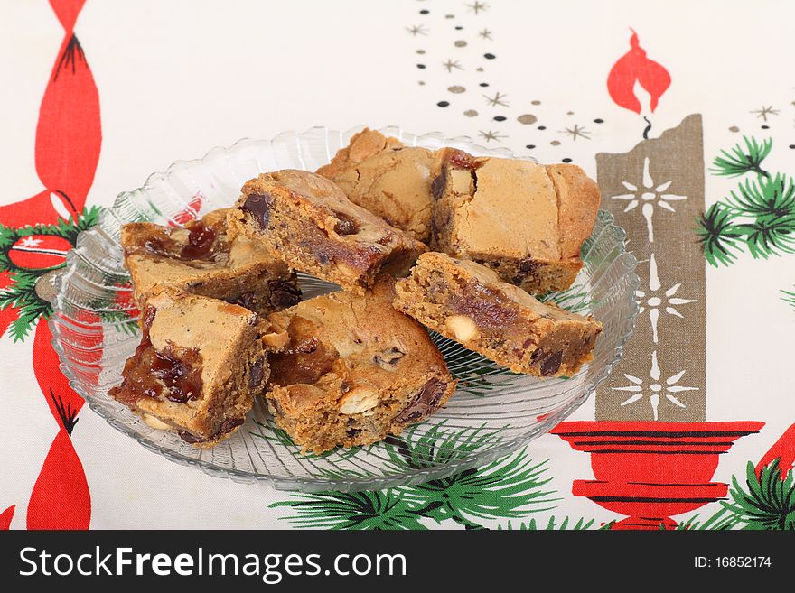 Pieces of peanut butter fudge on a Christmas tablecloth