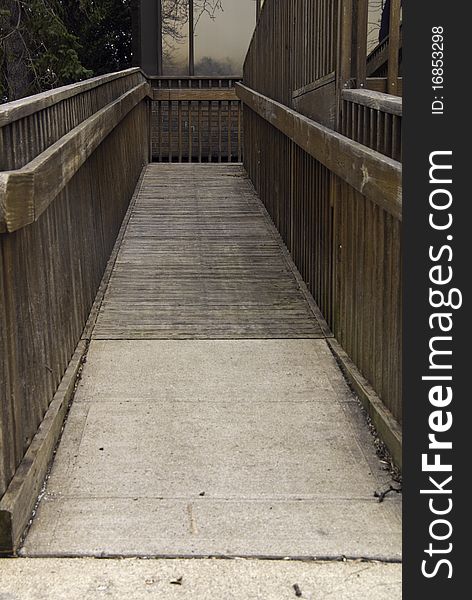 A building with a handicap ramp to the entrance. A building with a handicap ramp to the entrance.