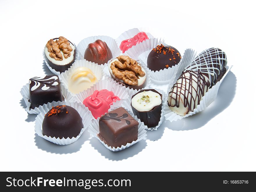 A lot of different candies on white background. A lot of different candies on white background