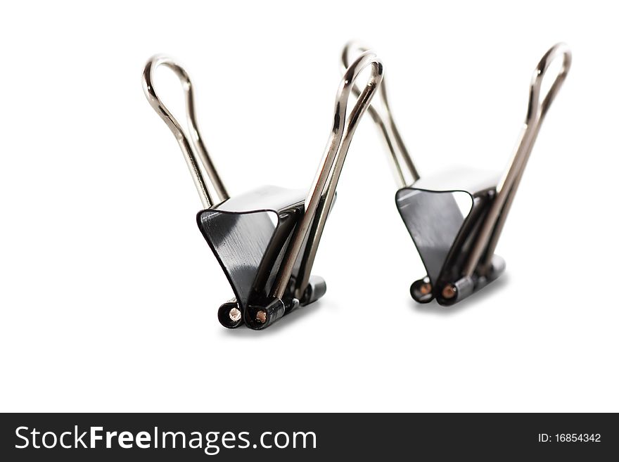 Black metal paperclips on white background. Black metal paperclips on white background