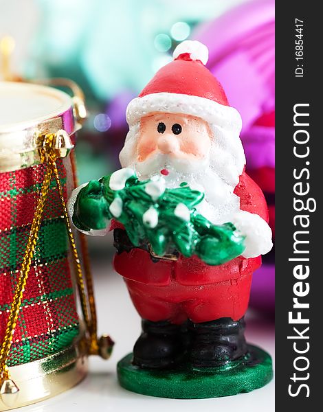 Christmas Santa Claus ornament in front of other decorations