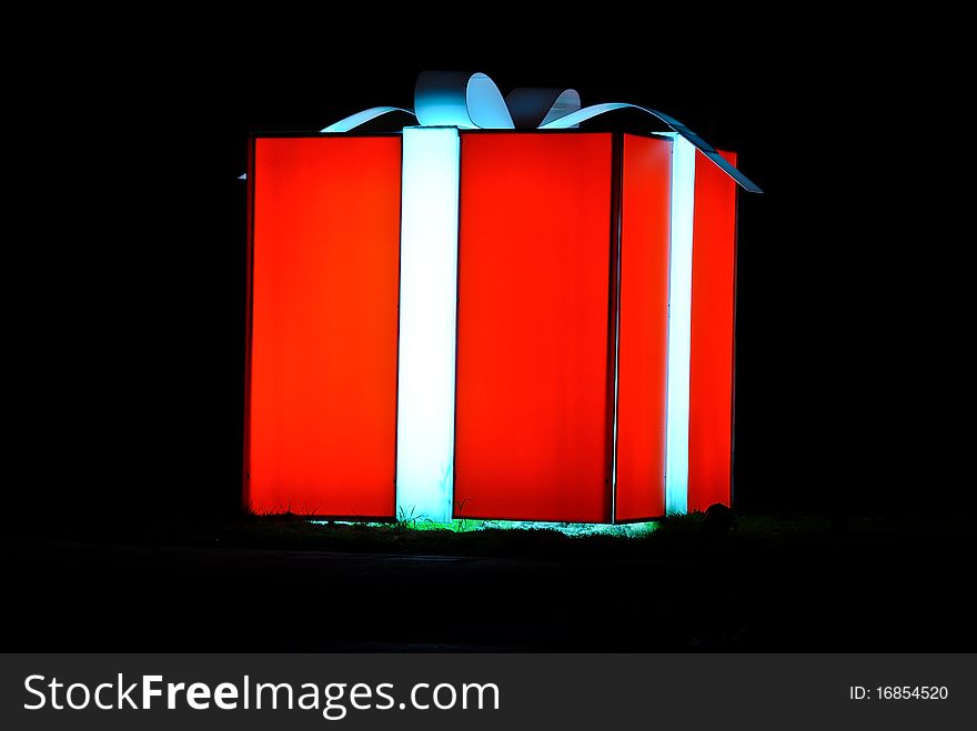 Gift red box on black background. Gift red box on black background
