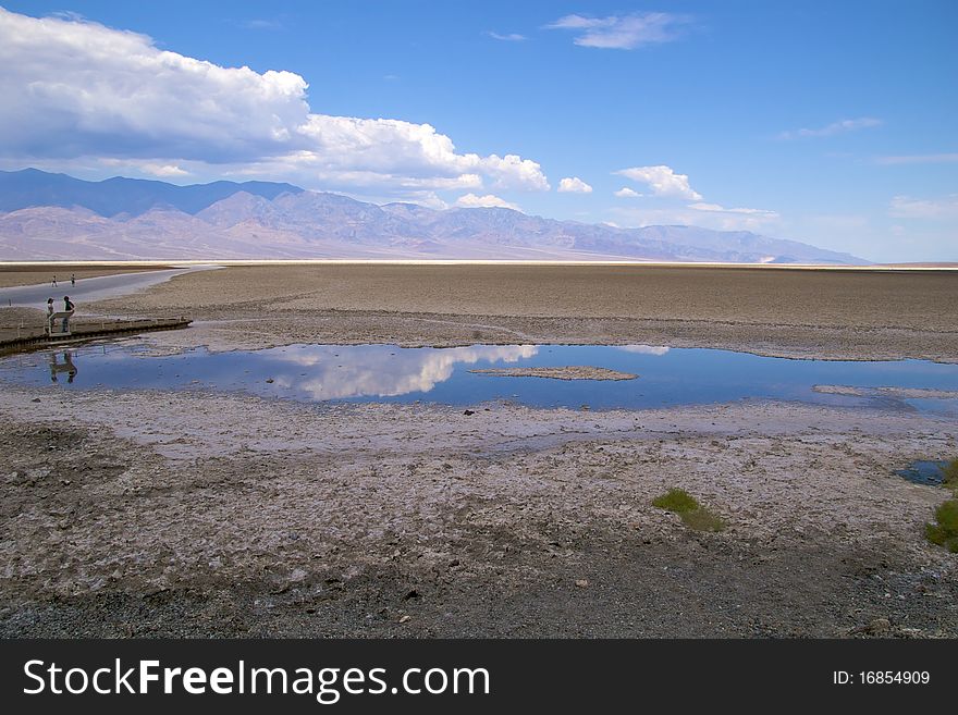 Tourists walking in Badwater Basin, Death Valley National Park. Tourists walking in Badwater Basin, Death Valley National Park