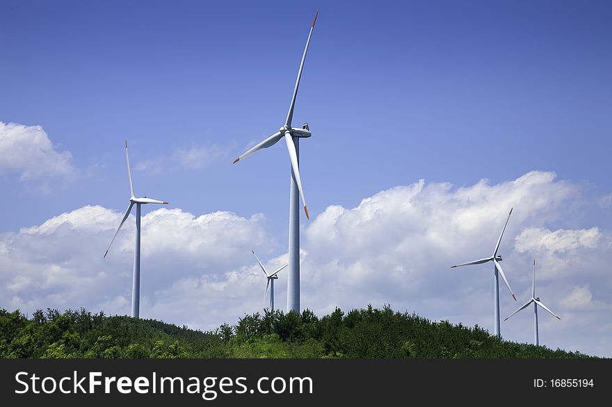 Power generating windmills is running on the hill