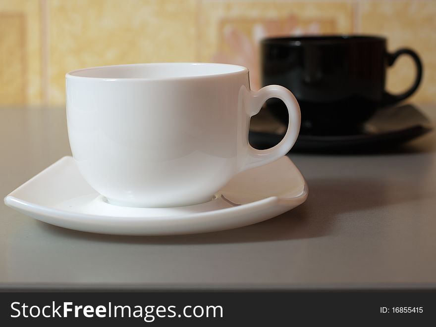 White cup of tea over kitchen table