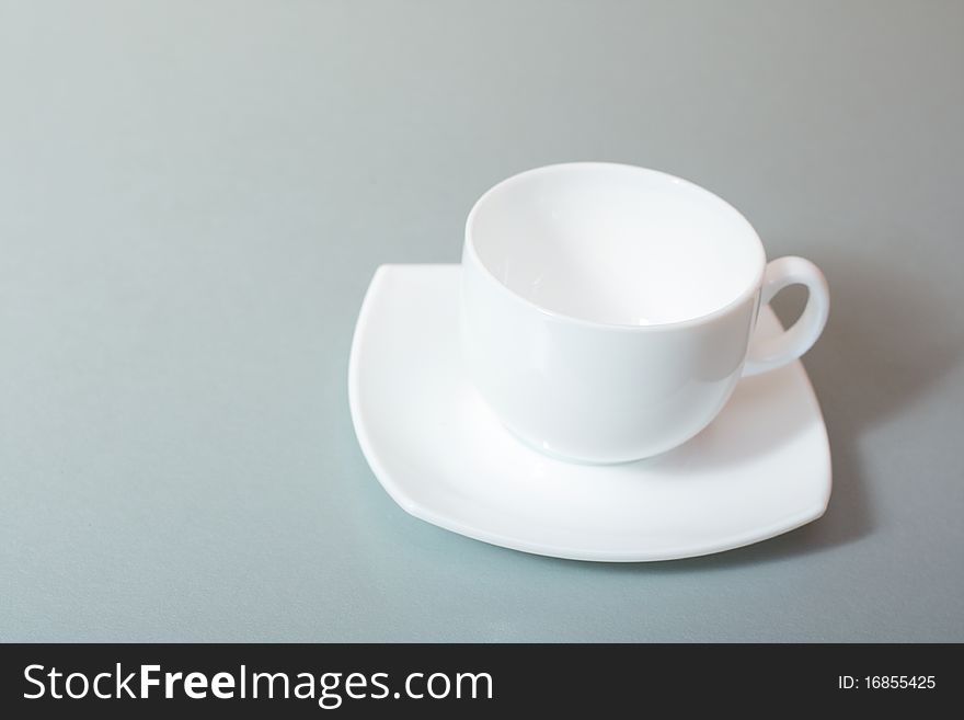 White cup of tea over kitchen table