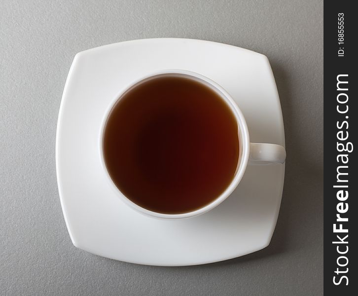 White cup of tea over kitchen table