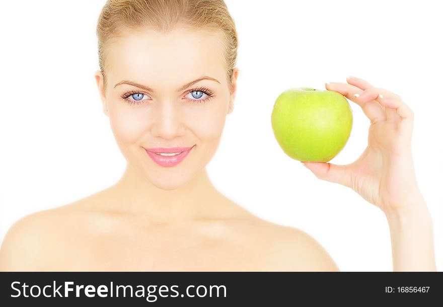 Attractive girl holding a green apple isolated on a white background