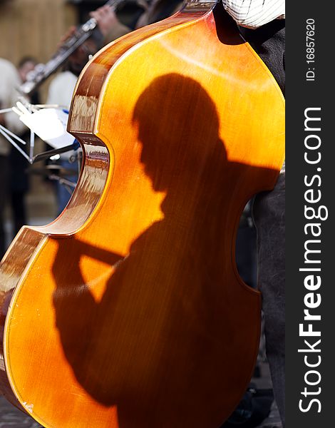 Cello in a street music group on summer