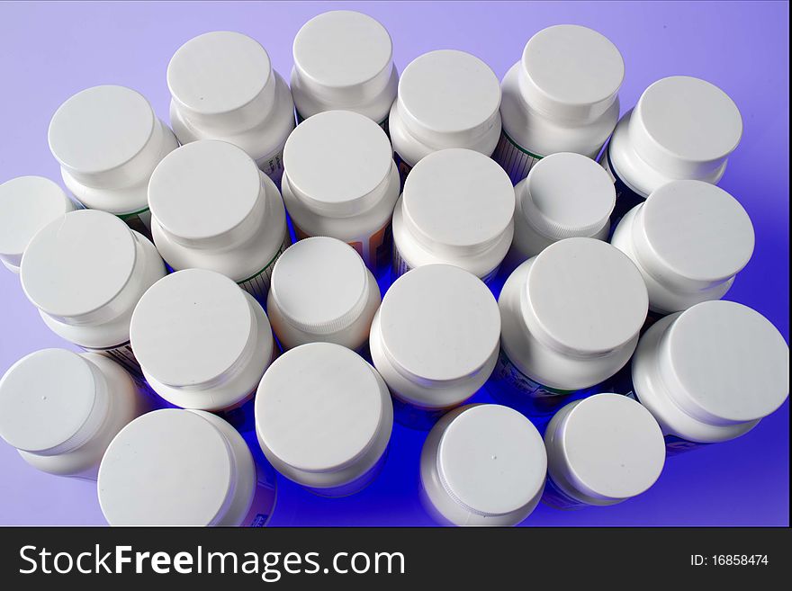 Large grouping of many unopened pill bottles