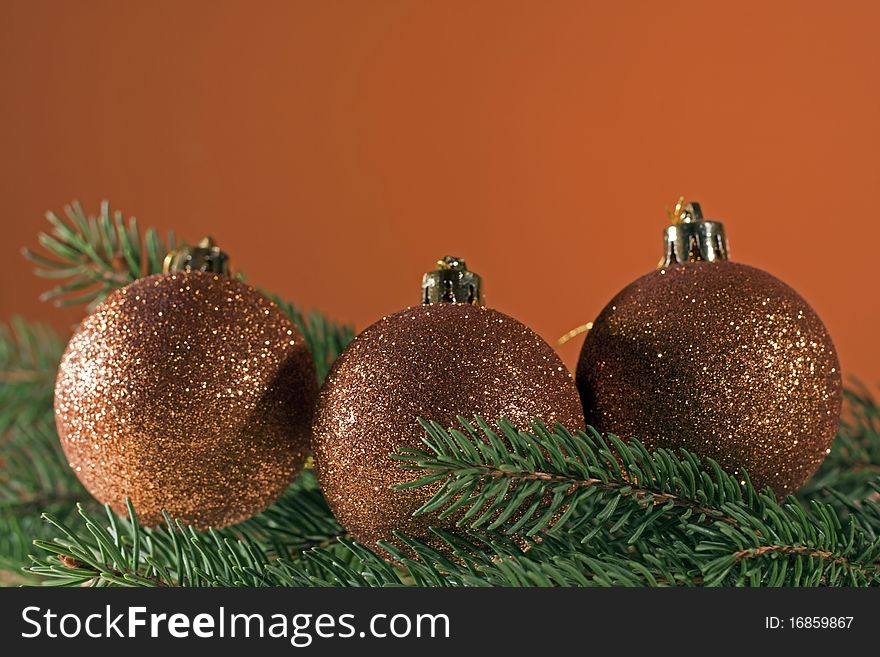 Christmas decoration, bronze christmas balls on spruce branch