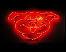Illuminated Pig Neon Sign For Butcher Shop Stock Photos