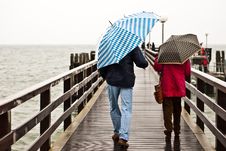 With Umbrella On The Pier Royalty Free Stock Image With Umbrella On The Pier Royalty Free Stock Image
