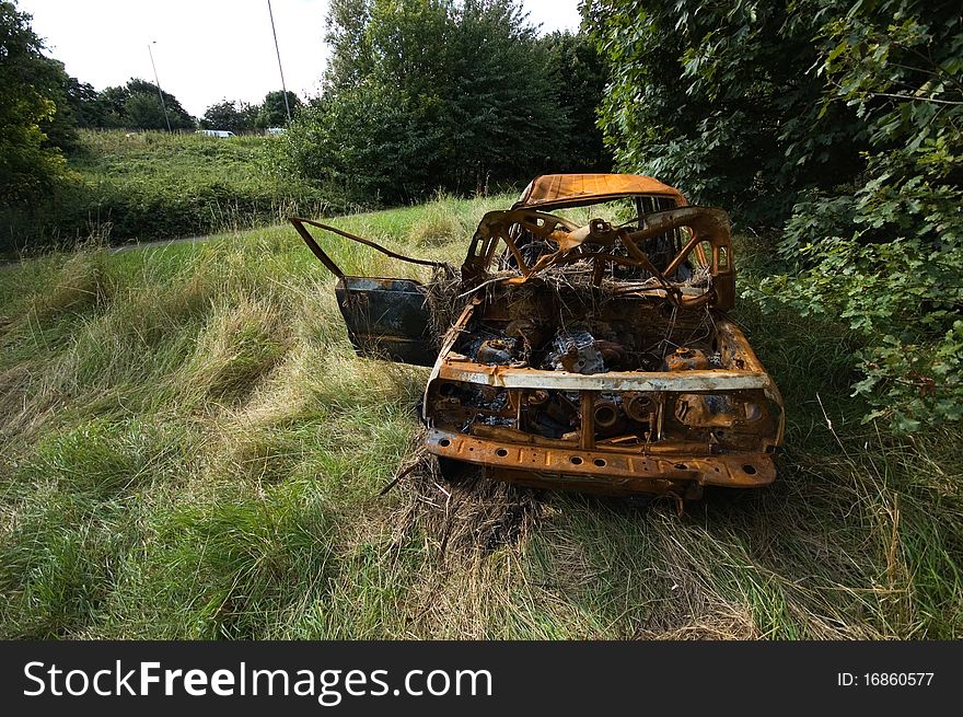 A stolen 4x4, found burnt out in a field. Taken with a wide angle lens.