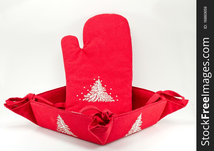 Red oven glove and bread basket