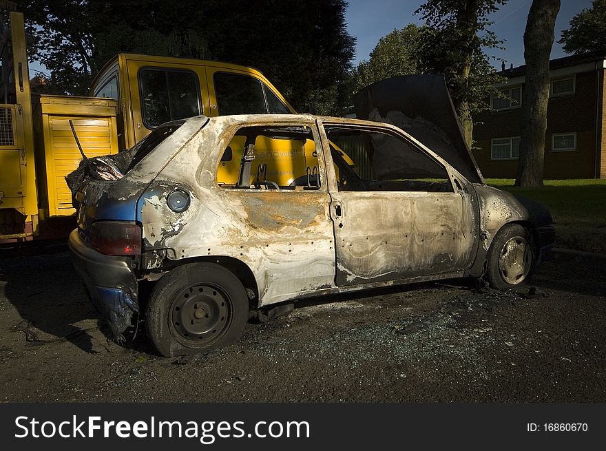 A stolen car, found burnt out in a side street. Taken early morning & with a polariser filter.