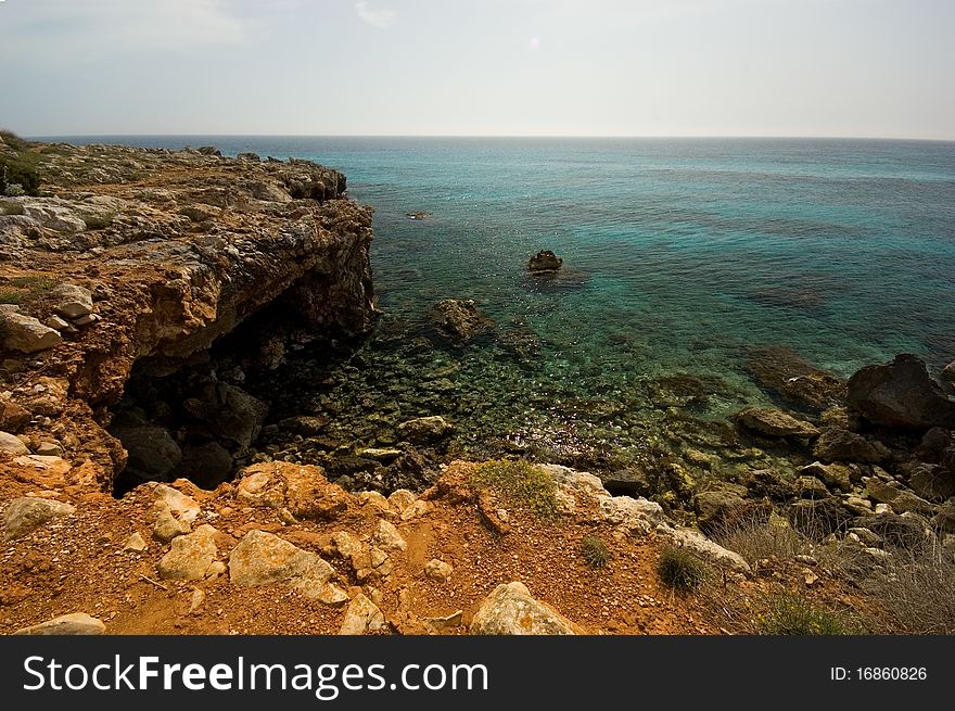 Rocky coastline on the Balearic island of Menorca. Taken with a wide angle lens & polariser filter. Rocky coastline on the Balearic island of Menorca. Taken with a wide angle lens & polariser filter.