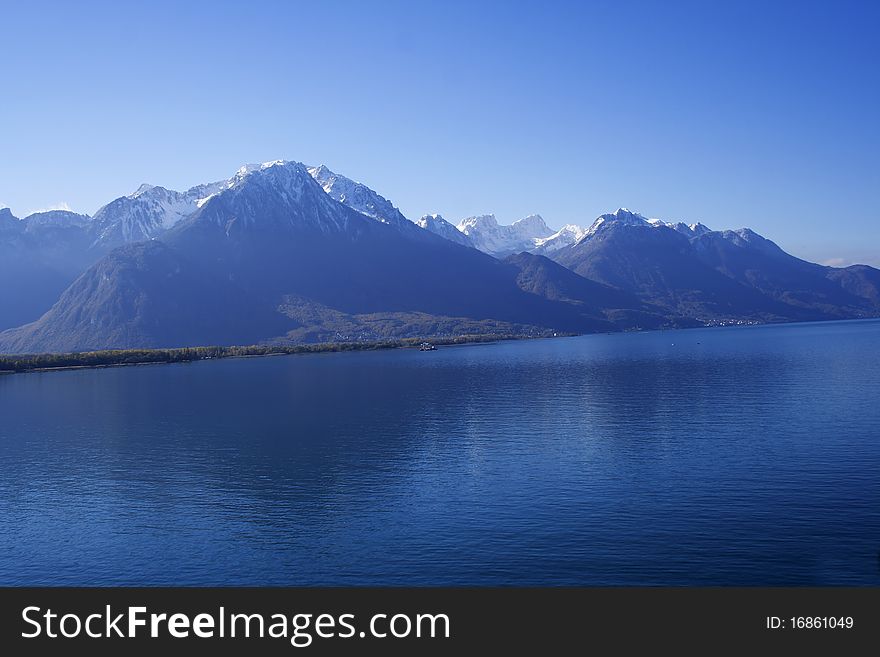 Alps over the lake Geneva on Montreaux, view from the Chillon castle. Alps over the lake Geneva on Montreaux, view from the Chillon castle