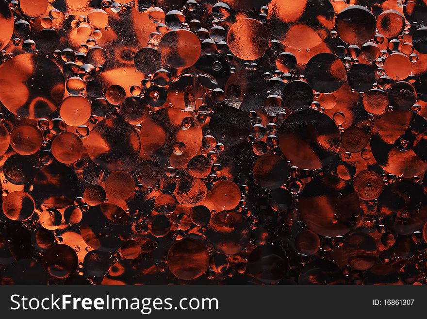 A background of red oil bubbles. A background of red oil bubbles.