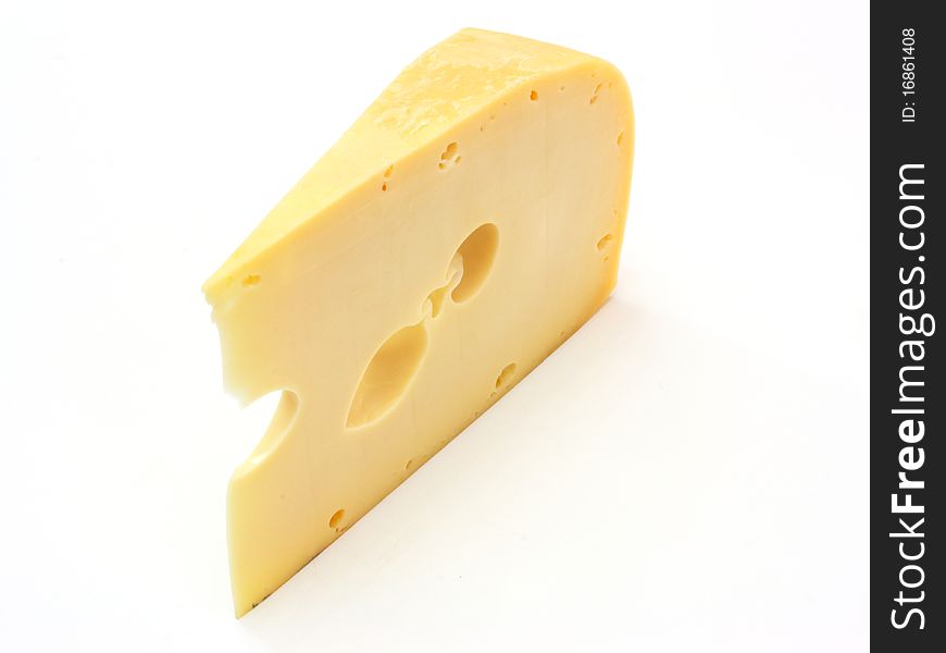 A piece of Swiss cheese isolated on white yellow delicatessen;