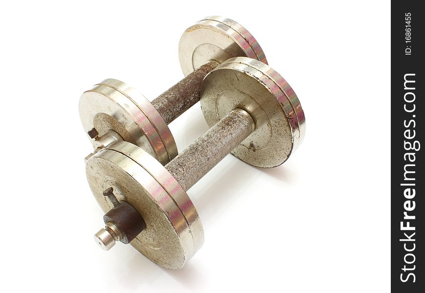 Two metal dumbbells lies on a white background
