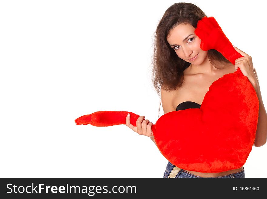Smiling woman with red heart shows somewhere - isolated on white background