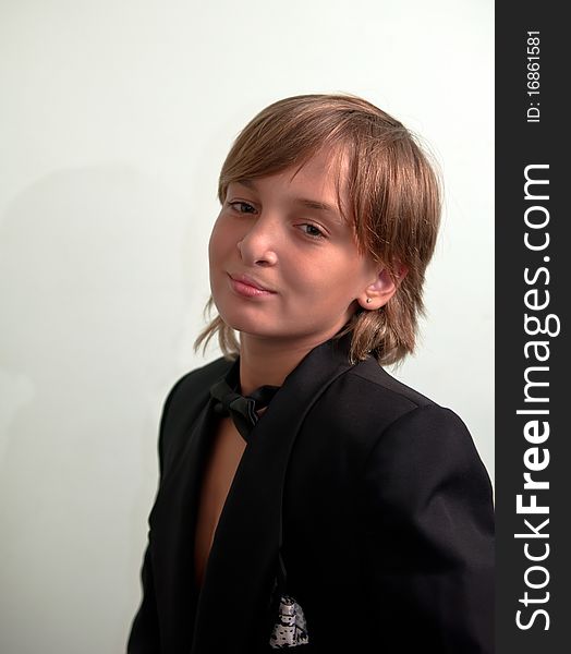 Boy wearing suit .