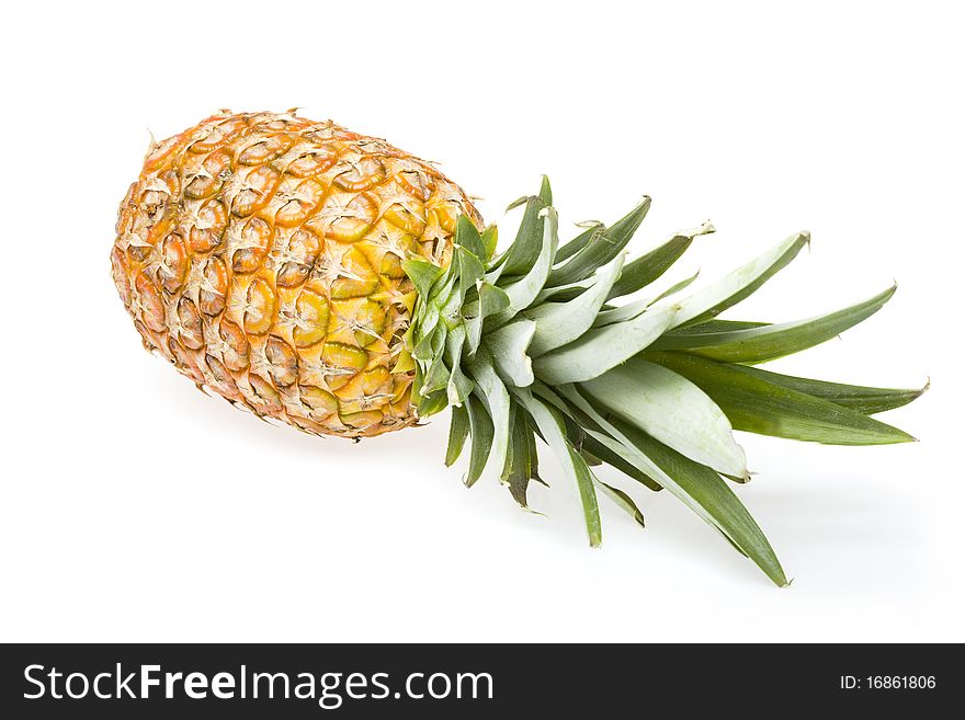 Fresh pineapple fruits with green leaf isolated on white background