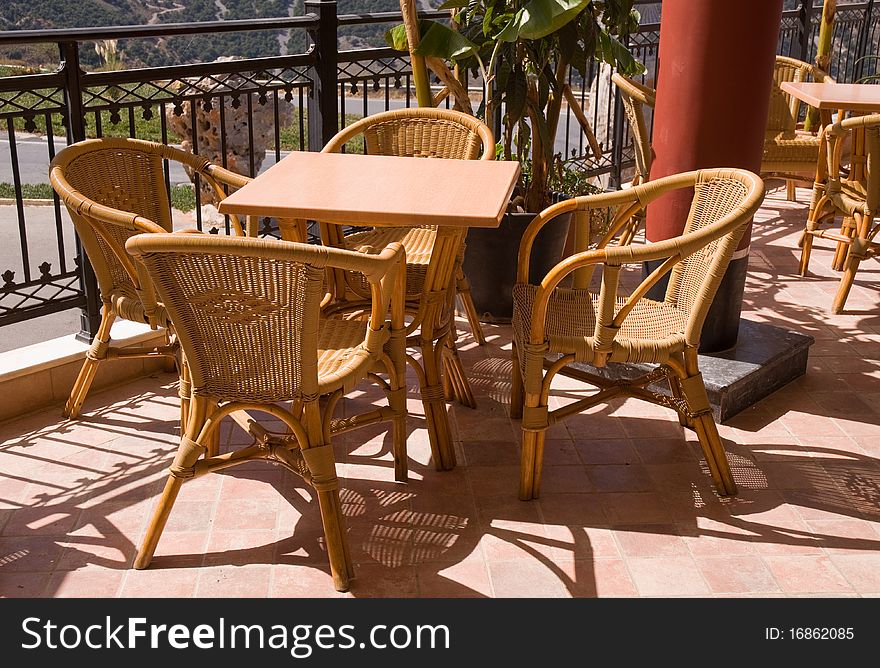 Cafe with wicker chairs on the balcony-style palace of Knossos. Crit. Greece. Cafe with wicker chairs on the balcony-style palace of Knossos. Crit. Greece.